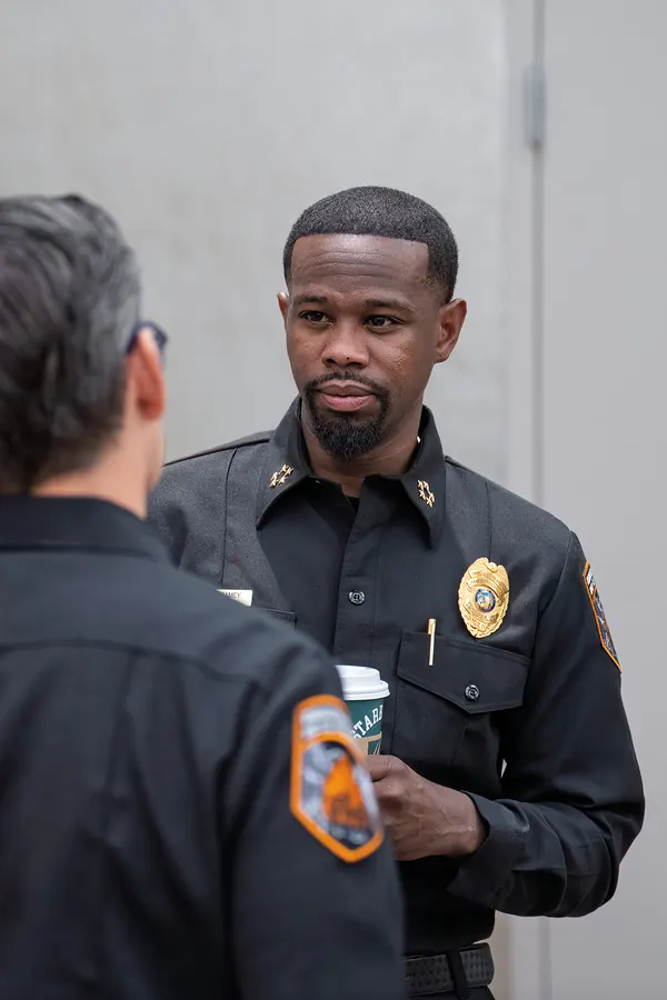 Candid photo of a fire chief in conversation